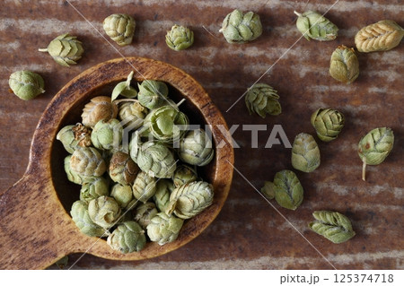 Crushed oregano (thyme) spice on a wooden bamboo spoon. Healthy eating concept. Selective Focus. 125374718