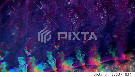 Liquid paint. Defocused fluid mix. Purple color beautiful sparkling soapy water floating bubbles going on blurred bokeh light abstract dark modern background. 125374834