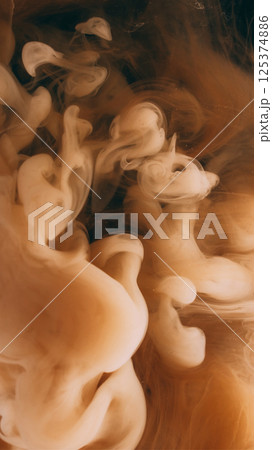 Smoke paint. Vapor cloud. Defocused yellow color splash ink in water explosion flow growing on abstract art dark black background. Smoke paint. Vapor cloud. Defocused yellow color splash ink in water explosion flow growing on abstract art dark black background. 125374886