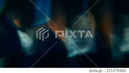 Optical texture. Blur light sparkle. Defocused golden yellow colorful lens flare on abstract art bokeh modern dark black background. 125374888
