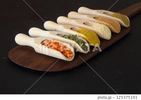 Big set of Indian spices on wooden table. Top view, Horizontal image. Big set of Indian spices on wooden table. Top view, Horizontal image. 125375101