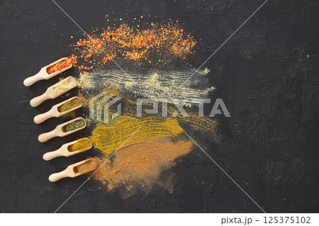 Big set of Indian spices on wooden table. Top view, Horizontal image. 125375102