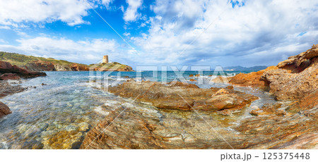 Amazing morning view of Piscinni bay with turquoise sea and famous coastal tower of Piscinni Amazing morning view of Piscinni bay with turquoise sea and famous coastal tower of Piscinni 125375448
