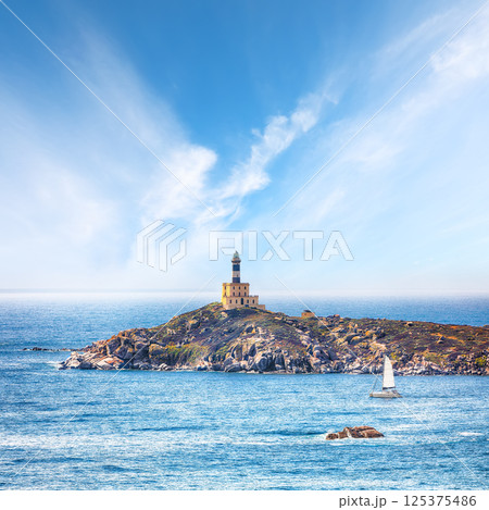 Marvelous view of Capo Carbonara lighthouse with turquoise water Marvelous view of Capo Carbonara lighthouse with turquoise water 125375486