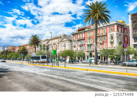 Street with typical architecture of the old center of Cagliari and Town Hall, Municipio di Cagliari. 125375499