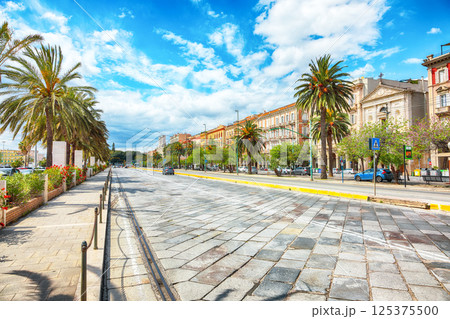 Street with typical architecture of the old center of Cagliari and Town Hall, Municipio di Cagliari. 125375500