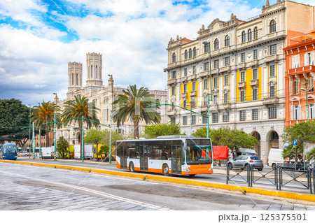 Street with typical architecture of the old center of Cagliari and Town Hall, Municipio di Cagliari. Street with typical architecture of the old center of Cagliari and Town Hall, Municipio di Cagliari. 125375501