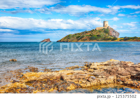 Gorgeous view on Ancient Spanish tower of Coltellazzo of Saint Efisio lighthouse at Nora archeological site 125375502