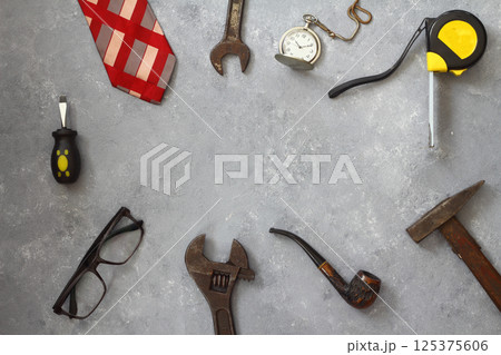 Top view design concept of Father 's day and labor day with working tools on black background 125375606