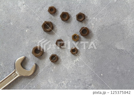 Wrench nuts on stone background. Father and Sons concept. Fathers and Labor Day concept. Flat lay. 125375842