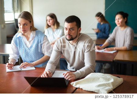 University students exercising in class room 125378917