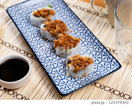 Curry roll - rolls with avocado, crab, cucumber and fried onion. Japanese traditional food Curry roll - rolls with avocado, crab, cucumber and fried onion. Japanese traditional food 125379303