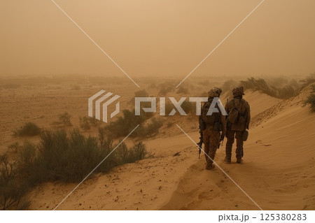 Group of infantrymen patrol area unwavering watching for signs of potential threats. A vigilant group of infantry soldiers carefully watches for any signs of danger during patrol. 125380283