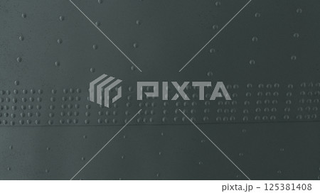 Abstract background made of metal cladding with rivets. Abstract background made of metal cladding with rivets. 125381408