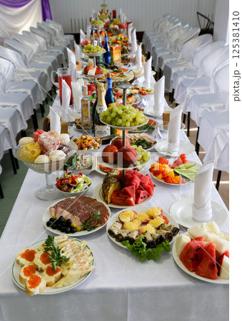 Wedding table with a variety of food. Wedding table with a variety of food. 125381410