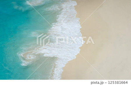 Aerial View of Waves on Sandy Beach 125381664