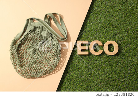 Eco bag, reusable, for shopping, on grass. 125381820