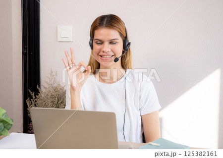 Professional young business woman working and meeting online in modern home office. 125382161