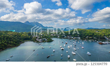 April 21 2025 Scenic Harbor View With Boats Anchored Under a Vibrant Sky April 21 2025 Scenic Harbor View With Boats Anchored Under a Vibrant Sky 125384770