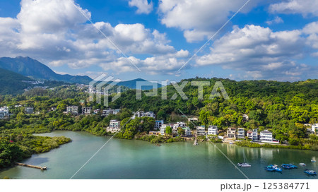 April 21 2025 Scenic Lakeside Homes Surrounded by Lush Green Hills 125384771