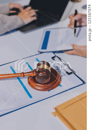 Concept of legal counseling. The lawyer or legal counsel is listening and providing advice to business people. 125387874