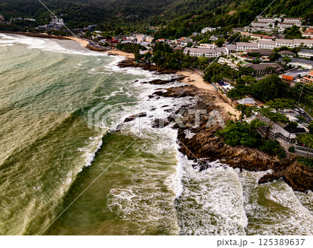 Top view seashore waves nature background,Amazing waves crashing on rocks seascape view 125389637