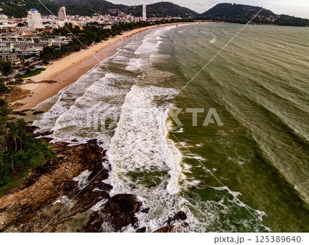 Top view seashore waves nature background,Amazing waves crashing on rocks seascape view 125389640