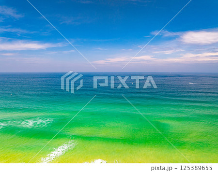 Aerial view beautiful sea surface nature background,Amazing waves texture ocean with clouds 125389655