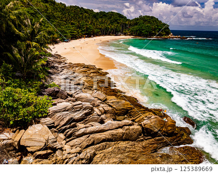 Top view seashore waves nature background,Amazing waves crashing on rocks seascape view Top view seashore waves nature background,Amazing waves crashing on rocks seascape view 125389669