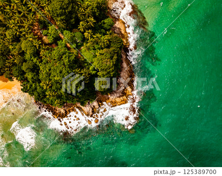 Top view seashore waves nature background,Amazing waves crashing on rocks seascape view Top view seashore waves nature background,Amazing waves crashing on rocks seascape view 125389700