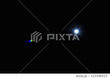 Sun flare on the black background 125390353