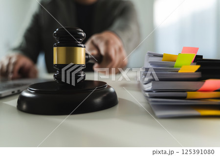 gavel and legal documents stacked books law in a library on legal documents gavel and legal documents stacked books law in a library on legal documents 125391080