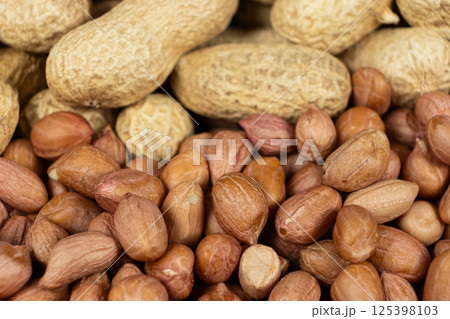 Shelled and Unshelled Peanuts Close-Up Shelled and Unshelled Peanuts Close-Up 125398103