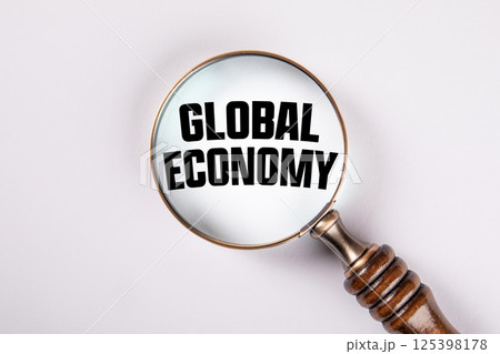 Magnifying Glass Focusing on GLOBAL ECONOMY Text Concept Magnifying Glass Focusing on GLOBAL ECONOMY Text Concept 125398178
