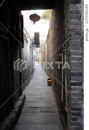 Old narrow street in Chinese water village Xitang. It is one of six destination ancient Town, located in Zhejiang Province, China Old narrow street in Chinese water village Xitang. It is one of six destination ancient Town, located in Zhejiang Province, China 125398589