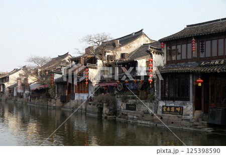 Chinese architecture and buildings lining the water canals to Xitang town in Zhejiang Province, China 125398590