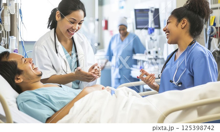 The doctor cheerfully communicates with the patient in the recovery room. Good news - the patient is recovering. A compassionate doctor brings smiles to the recovery room. 125398742
