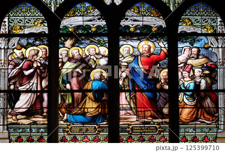 Jesus gives Peter the keys to the Kingdom, stained glass window in Saint Severin church in Paris, France 125399710