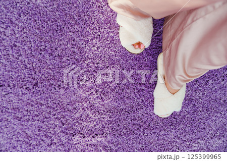 soft white slippers on the violet Interior pile carpet. soft white slippers on the violet Interior pile carpet. 125399965