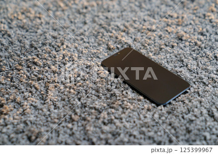 phone on the grey Interior pile carpet phone on the grey Interior pile carpet 125399967