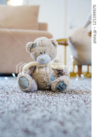 close-up. teddy bear on the grey Interior pile carpet made of polypropylene. close-up. teddy bear on the grey Interior pile carpet made of polypropylene. 125399970
