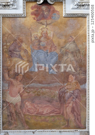 Virgin Mary with baby Jesus and Saints, fresco painting on the house facade in Graz, Styria, Austria Virgin Mary with baby Jesus and Saints, fresco painting on the house facade in Graz, Styria, Austria 125400508