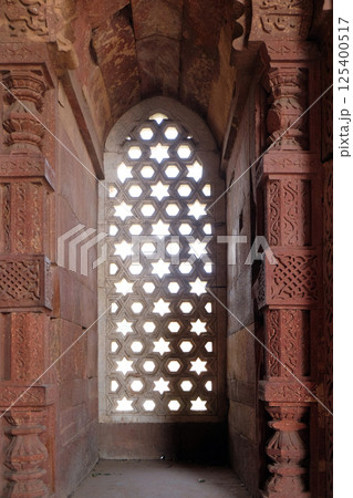 Window with sunglow in Alai Minar, Qutub Minar complex, Delhi, India Window with sunglow in Alai Minar, Qutub Minar complex, Delhi, India 125400517