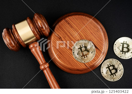 Judge gavel and gold bitcoins to the concept of judgement of cryptocurrencies. 125403422