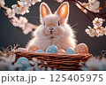 Easter bunny with basket of colorful eggs in a blooming garden. 125405975