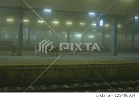 Foggy Train Station with Benches and Soft Lighting 125406014