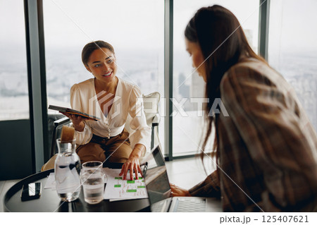A Collaborative Business Meeting Taking Place in a Modern Office Space Environment A Collaborative Business Meeting Taking Place in a Modern Office Space Environment 125407621