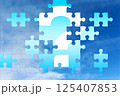 Missing puzzle piece with question mark on blue sky background 125407853