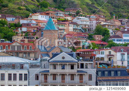 Traditional carved balconies and colorful wooden houses in the Old Town of Tbilisi 125409060