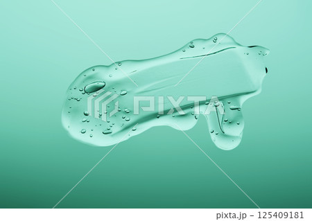 Gel cosmetic texture on a green background. 125409181
